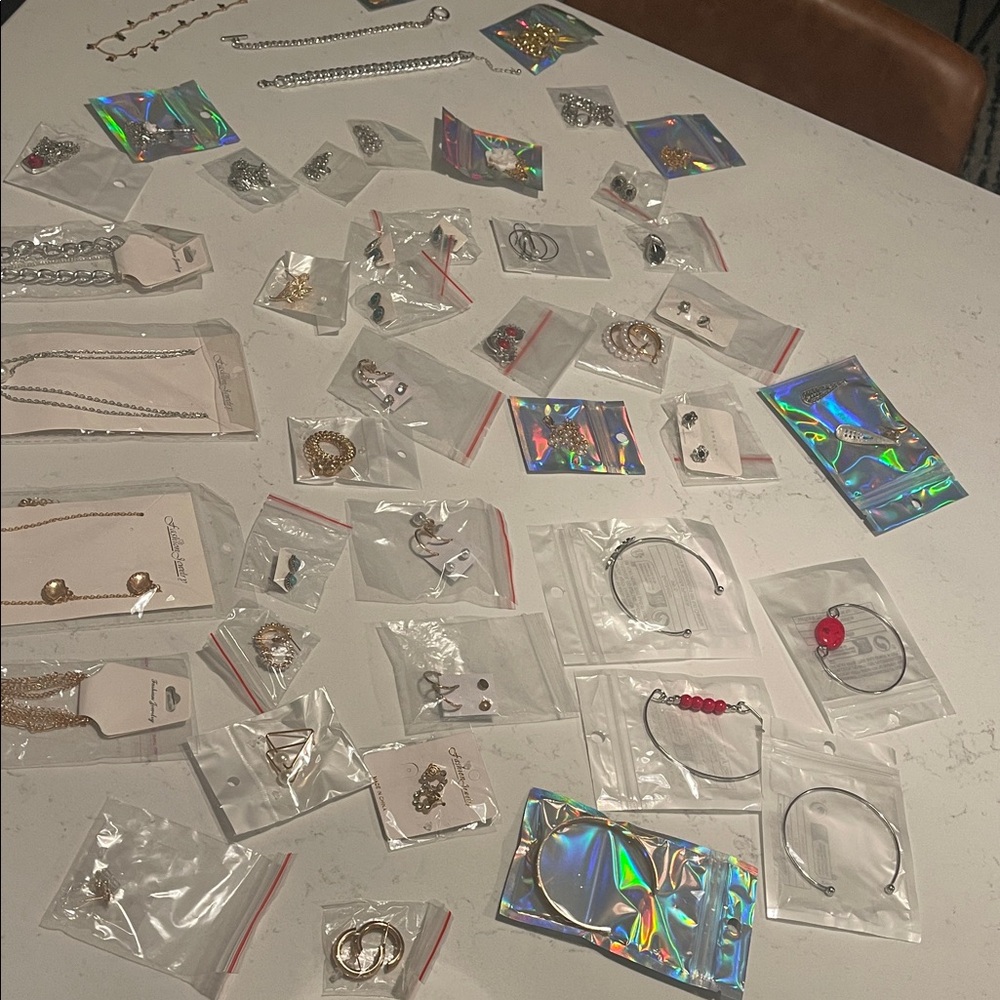 44 pieces of Jewelry. New. Necklace bracelet earrings